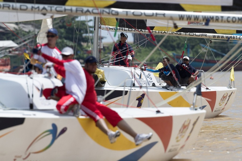 Racing on day 1 at the Malaysian Match Racing Championships. Kuala Terengannu, Malaysia. 7 October 2011. Photo: Gareth Cooke/Subzero Images © SW